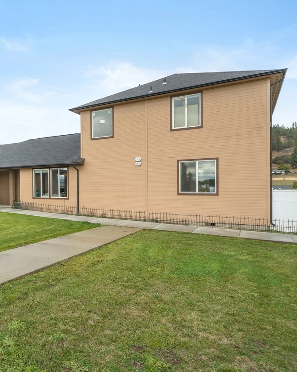Exterior walkway and lawn at A+ Quality Adult Family Home